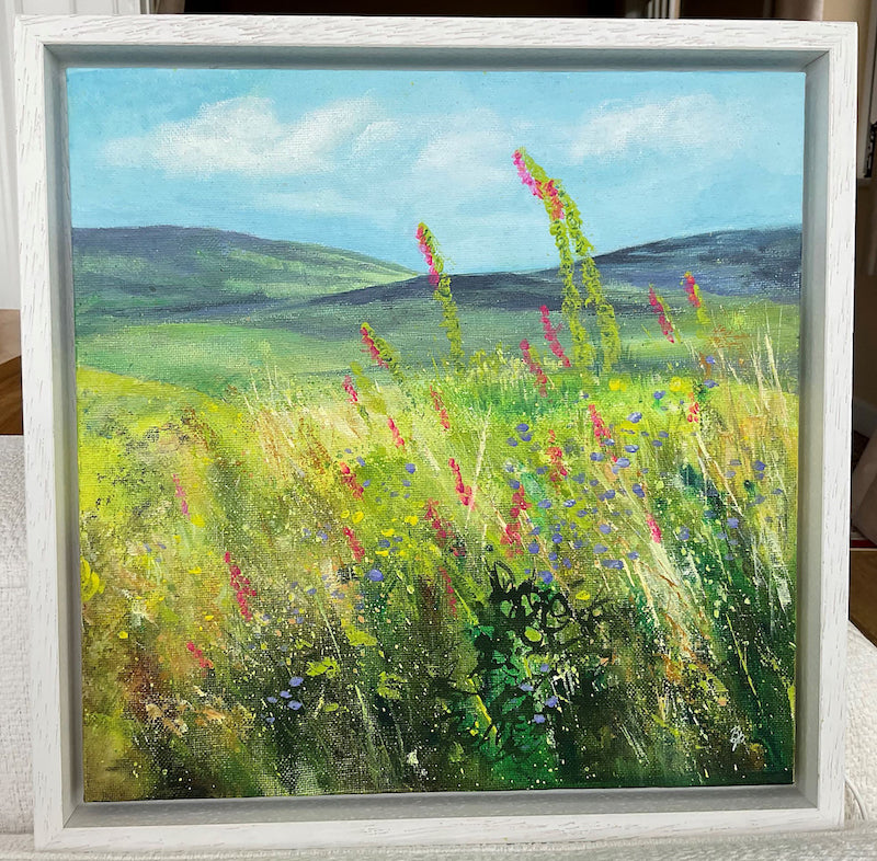 Hedgerow original wildflower and hills painting framed in a white box frame by Beverley Perry Artist